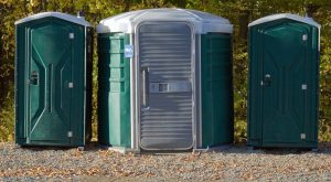 ada compliant porta potty in gravel